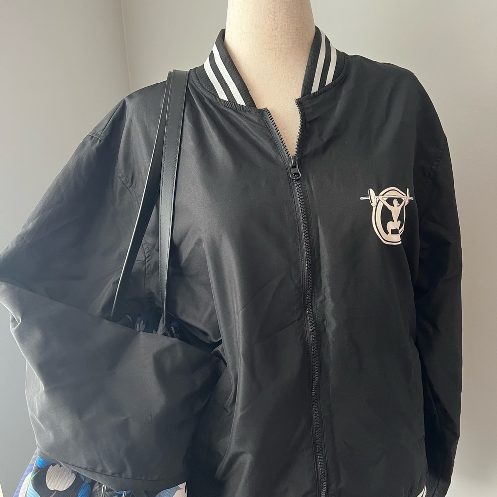 Barbells and Ponytails Black Varsity Jacket with Striped Ribbing and Logo Patch